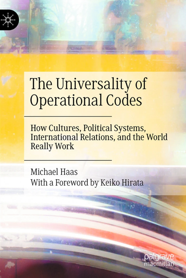 A book cover with abstract watercolor-like paint strokes across it reads, 'The Universality of Operation Codes: How Cultures, Political Systems, International Relations, and the World Really Work,' written by Michael Haas with a foreword written by Keiko Hirata.